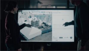 two people looking at a screen showing the 3D Mill Race area in Lancaster